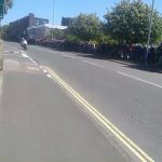 Heartstopping moment football rolls down hill as Isle of Man TT riders zoom past in narrow miss while at 130mph