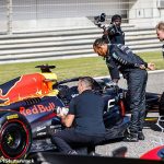 Checking out the competition! Lewis Hamilton enjoys a cheeky look at Red Bull's car during a spy mission at F1's pre-season testing in Bahrain, as the seven-time world champion bids to bounce back this season